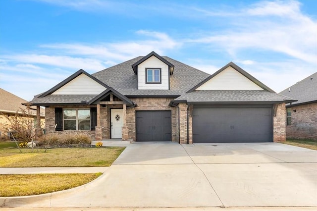 view of front of property with a garage and a front lawn