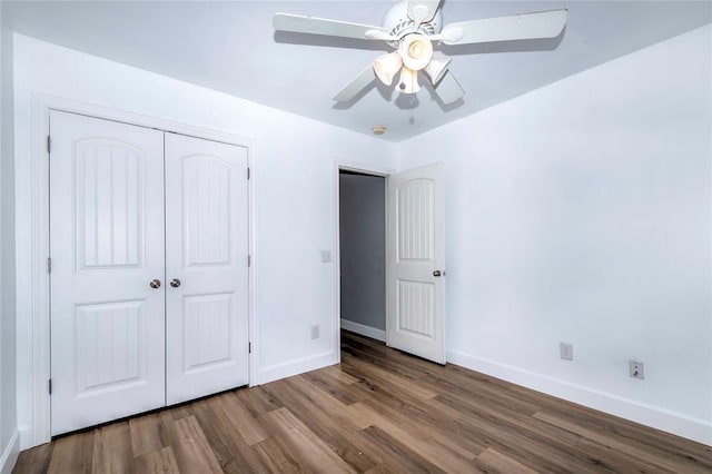 unfurnished bedroom with hardwood / wood-style floors, a closet, and ceiling fan