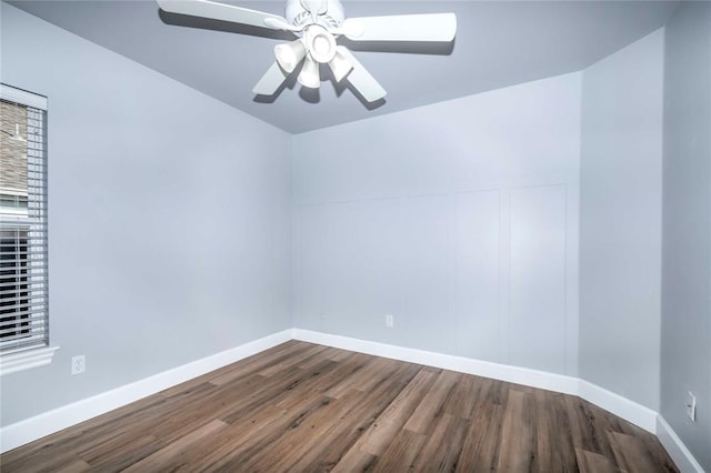 spare room with ceiling fan and wood-type flooring