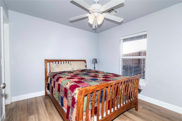 bedroom featuring ceiling fan and wood-type flooring