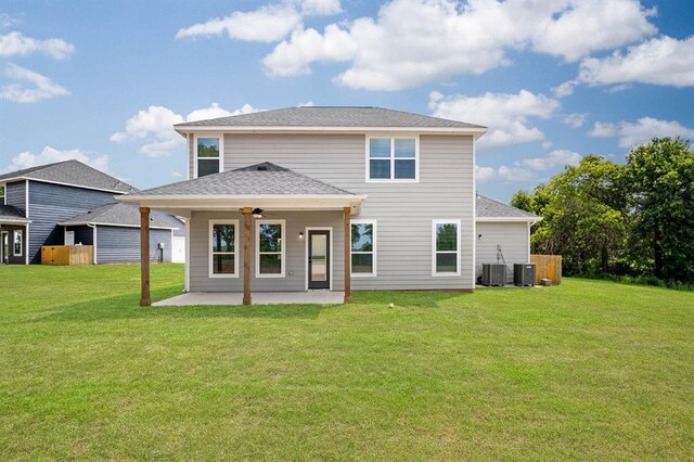 rear view of house with a lawn, a patio area, ceiling fan, and cooling unit