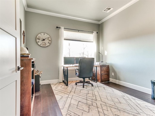 office space featuring ornamental molding, visible vents, baseboards, and wood finished floors