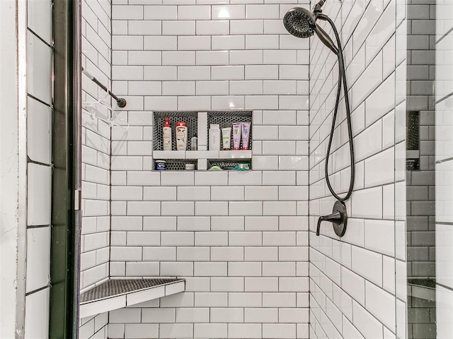 full bathroom with tiled shower