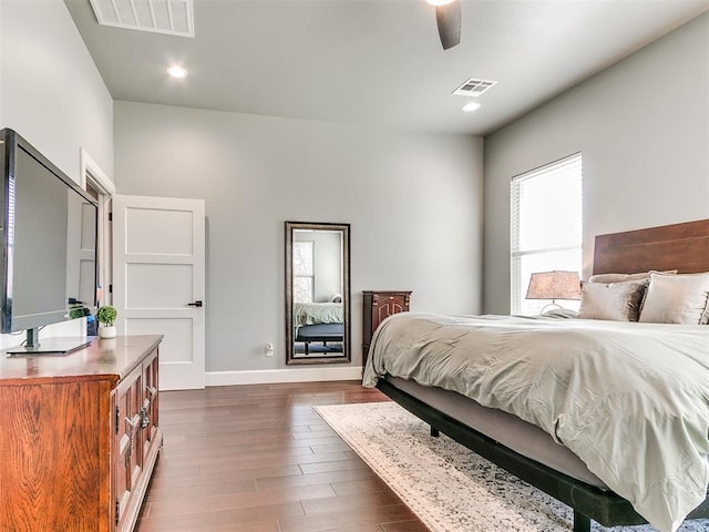 bedroom featuring recessed lighting, visible vents, dark wood finished floors, and baseboards