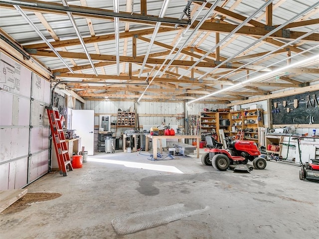 garage with a workshop area and metal wall