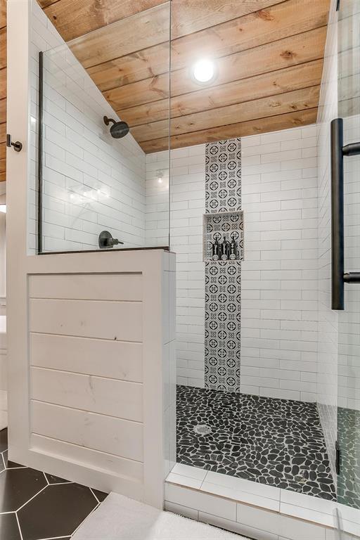 bathroom with wooden ceiling and walk in shower