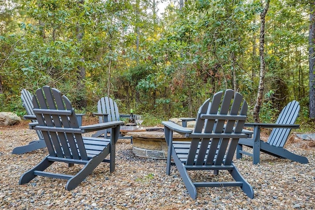 view of yard featuring an outdoor fire pit