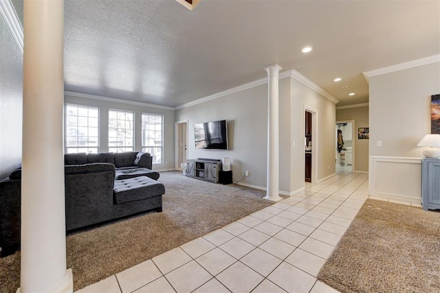 carpeted living room with ornate columns, crown molding, and a textured ceiling