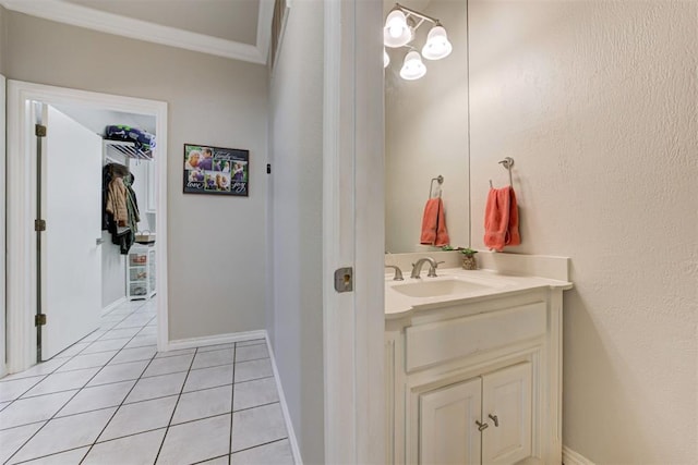 bathroom featuring tile patterned flooring and vanity