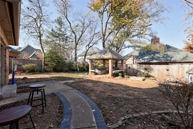 view of yard featuring a gazebo and a patio area