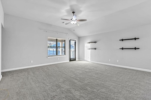 spare room featuring carpet, ceiling fan, and lofted ceiling