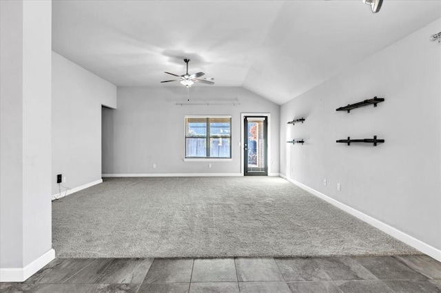 unfurnished room featuring ceiling fan, carpet, and lofted ceiling