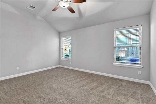 empty room with carpet flooring, ceiling fan, and lofted ceiling