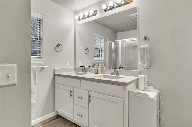 bathroom with vanity and walk in shower