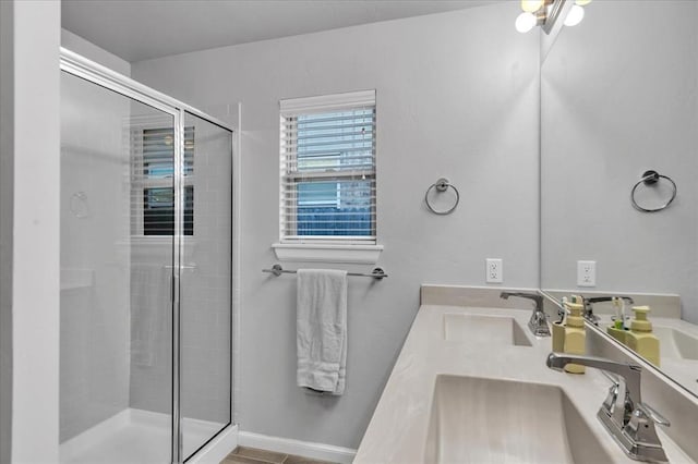 bathroom featuring vanity and an enclosed shower