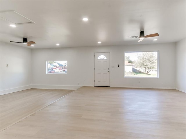 foyer featuring light wood-type flooring and ceiling fan