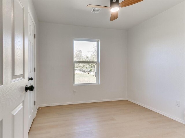 spare room featuring ceiling fan and light hardwood / wood-style flooring