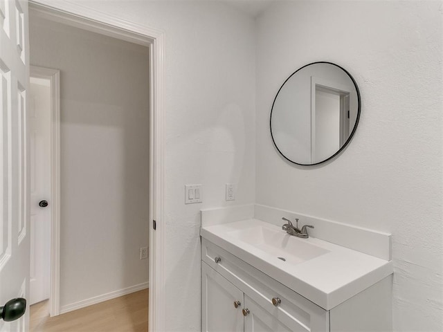 bathroom featuring vanity and hardwood / wood-style flooring