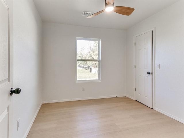 spare room featuring ceiling fan and light hardwood / wood-style flooring