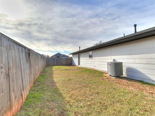 view of yard featuring central air condition unit