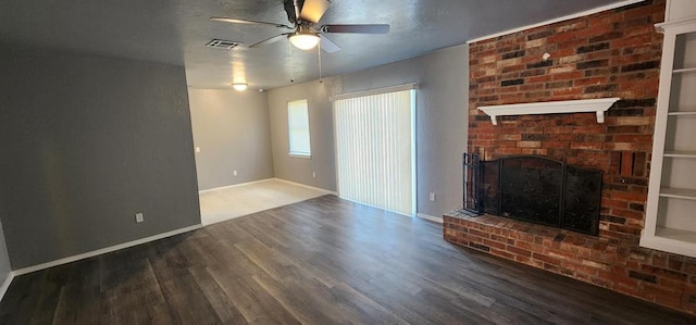 unfurnished living room featuring ceiling fan, a fireplace, and hardwood / wood-style flooring