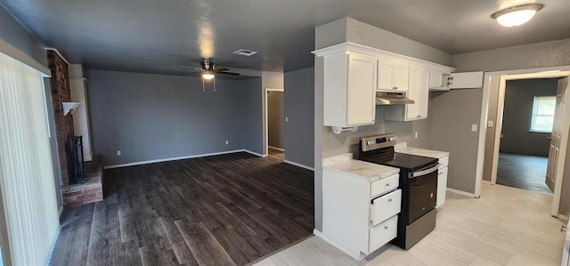 kitchen with white cabinets, wood-type flooring, electric range, and ceiling fan