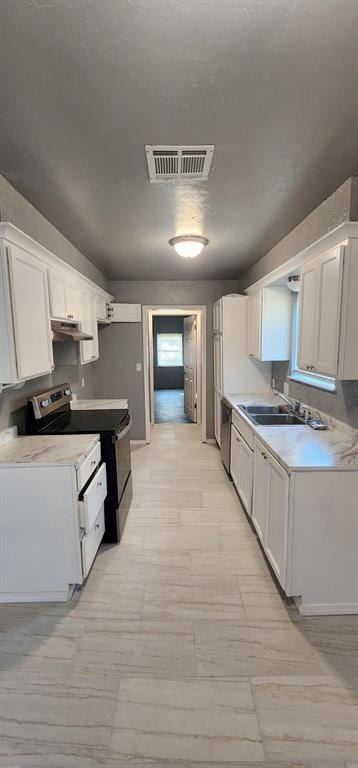 kitchen with sink, white cabinets, and black range with electric cooktop