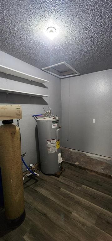 utility room featuring water heater