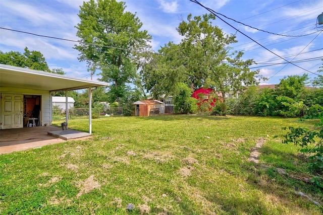 view of yard with a patio area and a shed