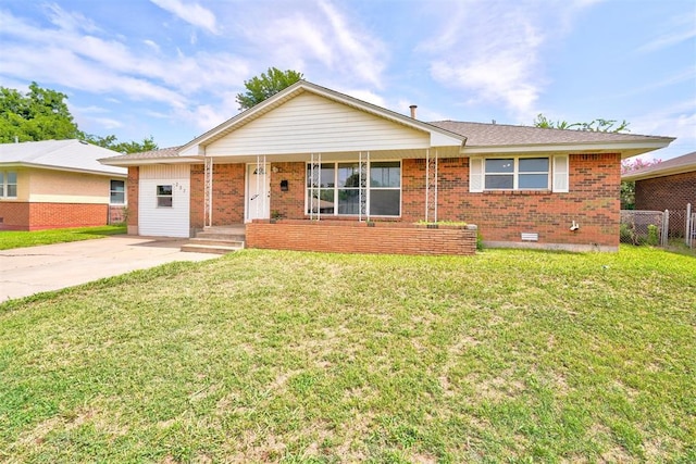 ranch-style house featuring a porch and a front lawn