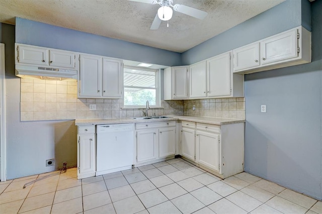 kitchen with white cabinets, white dishwasher, ceiling fan, and sink