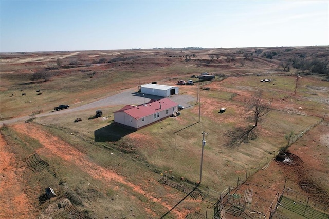 birds eye view of property with a rural view