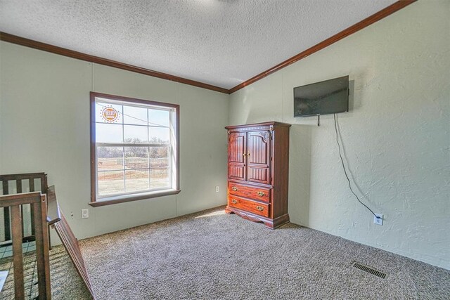 unfurnished bedroom with crown molding, vaulted ceiling, carpet floors, and a textured ceiling