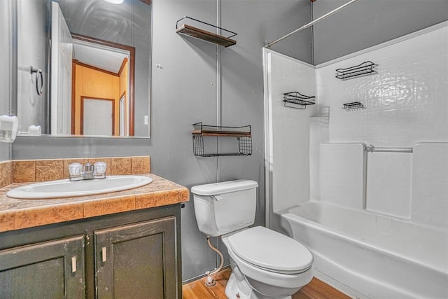 full bathroom with vanity, toilet, shower / washtub combination, and wood-type flooring