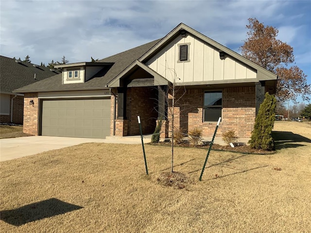 view of front facade with a garage and a front lawn