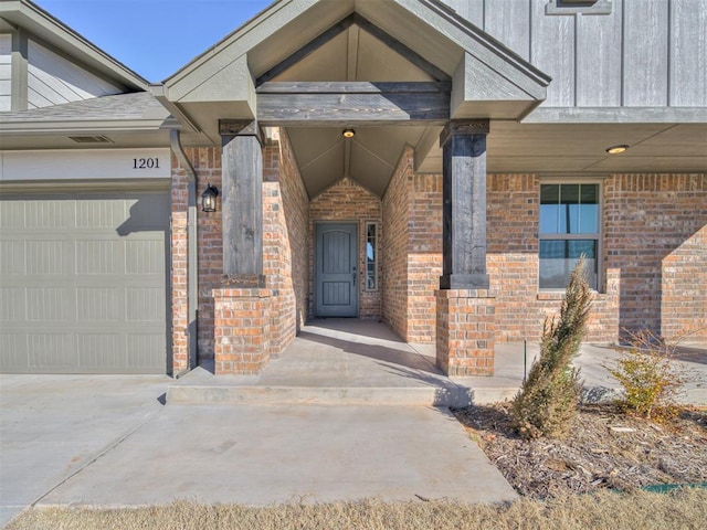 doorway to property featuring a garage