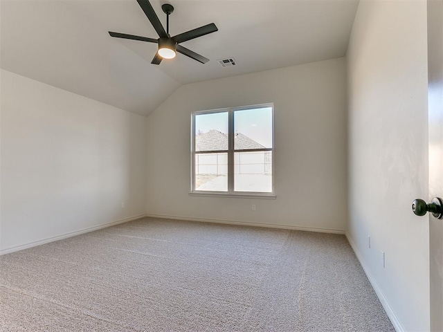 empty room with carpet, vaulted ceiling, and ceiling fan