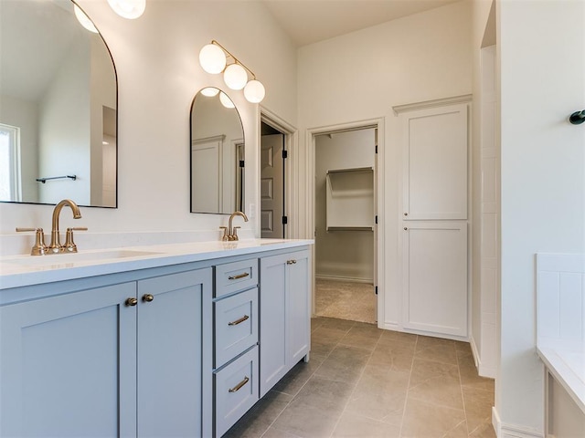 bathroom featuring tile patterned flooring and vanity