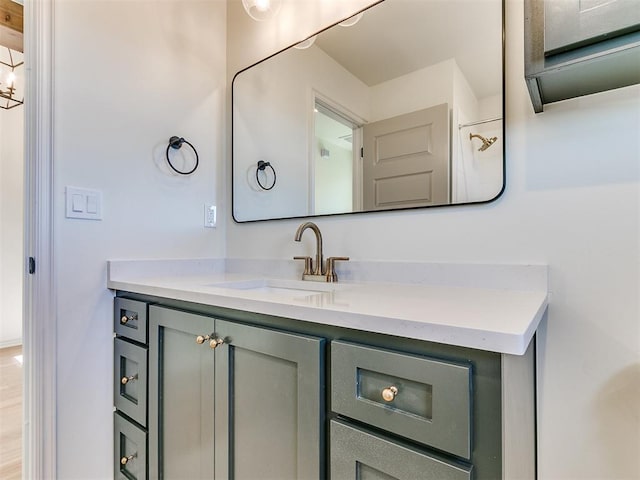 bathroom featuring hardwood / wood-style flooring and vanity