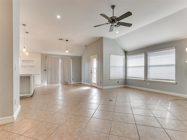 unfurnished living room with ceiling fan, light tile patterned flooring, and lofted ceiling