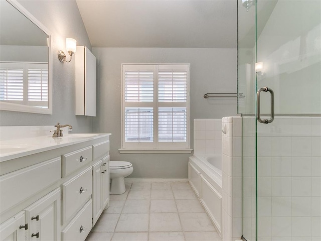 full bathroom featuring vanity, toilet, and independent shower and bath