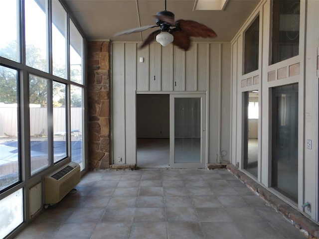 8300 Brookridge Dr, Oklahoma City, OK 73132 - unfurnished sunroom featuring an AC wall unit, plenty of natural light, and ceiling fan