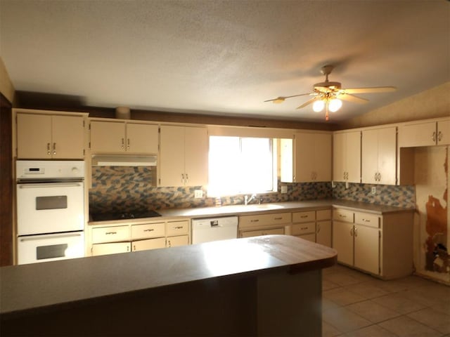 8300 Brookridge Dr, Oklahoma City, OK 73132 - kitchen with ceiling fan, sink, vaulted ceiling, white appliances, and decorative backsplash