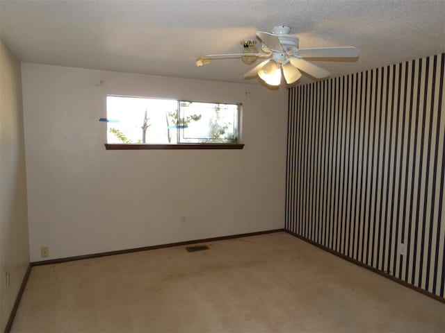 8300 Brookridge Dr, Oklahoma City, OK 73132 - carpeted empty room with ceiling fan and a textured ceiling
