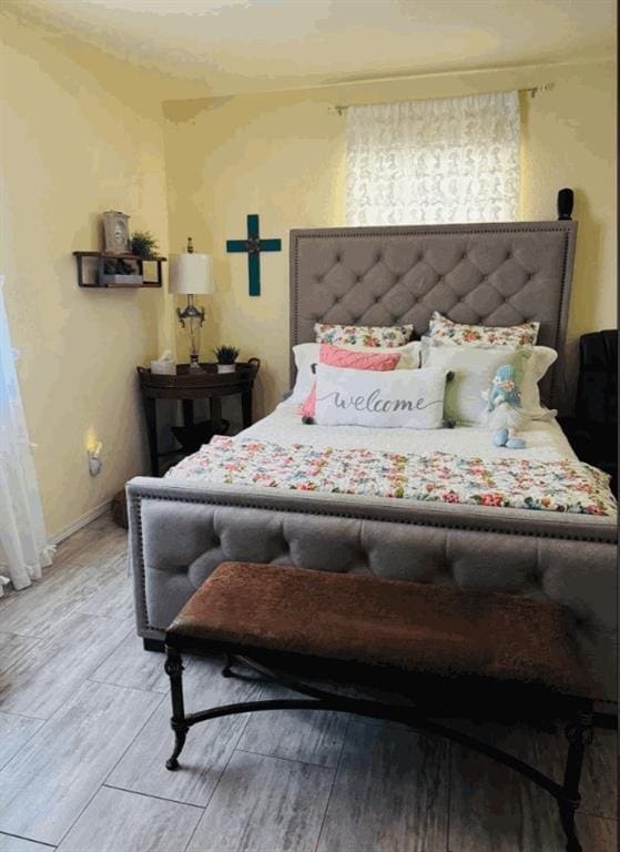 bedroom featuring wood-type flooring