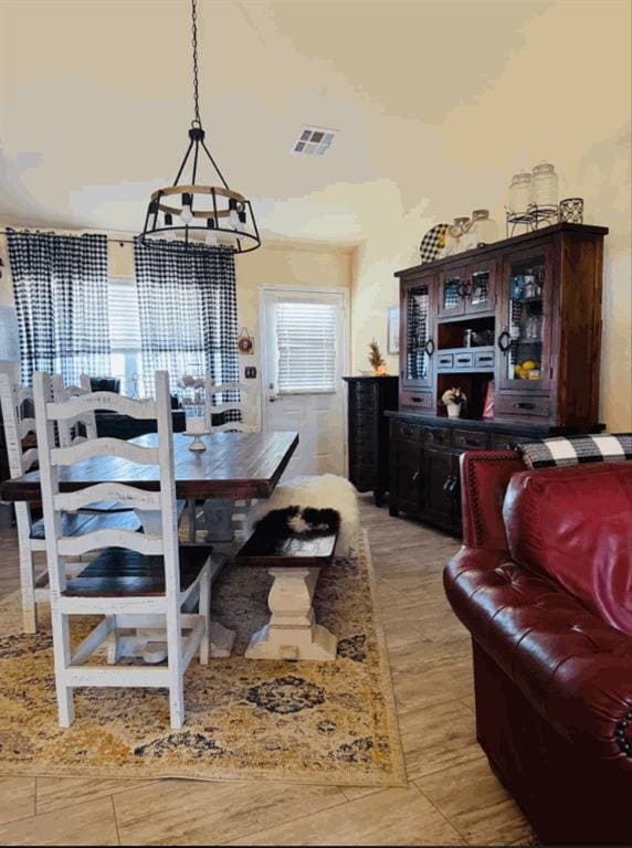 dining room with a notable chandelier