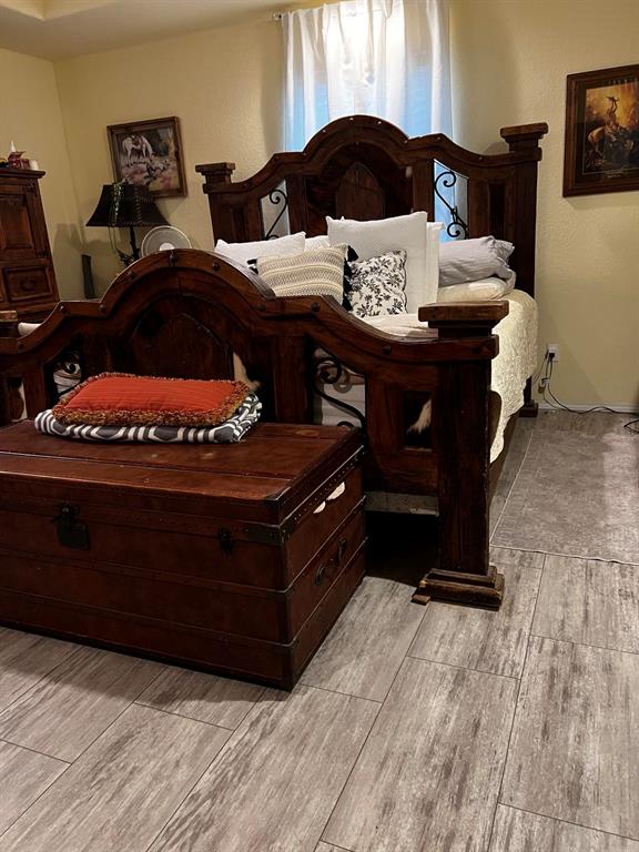 bedroom with light hardwood / wood-style flooring