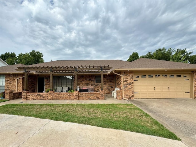 view of front of home with a pergola and a garage