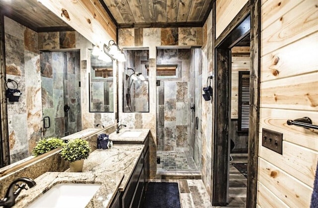 bathroom with wooden walls, vanity, wooden ceiling, and walk in shower