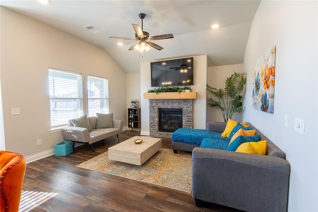 living room with lofted ceiling, a fireplace, ceiling fan, and dark hardwood / wood-style floors